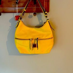 NWOT Dooney and Bourke yellow leather purse.